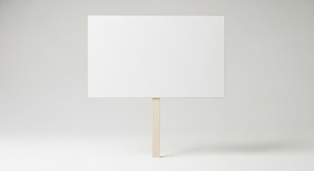 Blank white sign on a wooden stick, isolated on white background