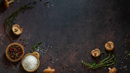 A selection of ingredients against a dark background with copy space.