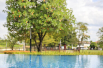 Abstract blur outdoor swimming pool in tropical resort hotel summer background
