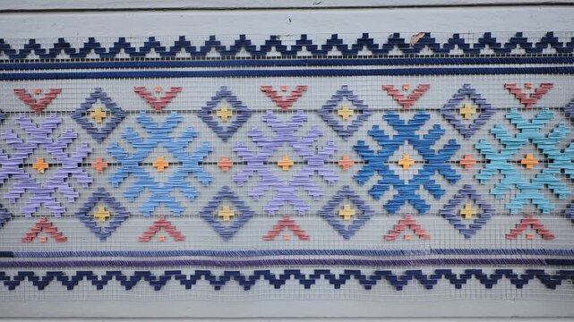 Traditional Latvian wall ornament with geometric Auseklitis star, rhombus shapes