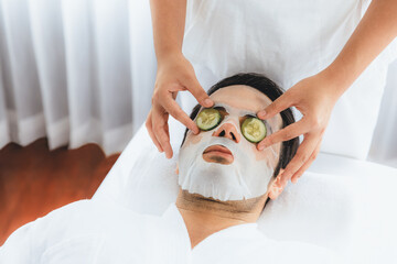 Serene daylight ambiance of spa salon, man customer indulges in rejuvenating with luxurious...