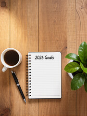 2026 goals notebook on wooden desk with coffee