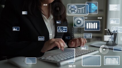 A business professional engages with digital data, showcasing futuristic interfaces and diverse graphs in a modern workspace focused on analytical insights. Xenic