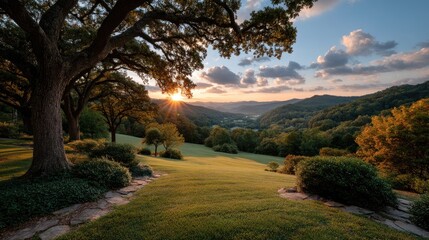 Golden Sun Rays Break Through Wispy Clouds Over Lush Green Valley at Sunset With Silhouetted Trees and Gentle Hills