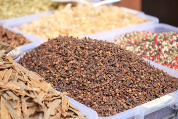 Spices displayed at a vibrant market in the afternoon sun