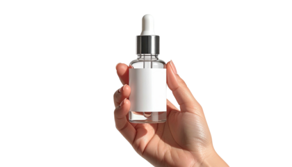 Serum bottle held against black background