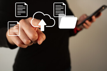 Uploading documents to the cloud folder. A businesswoman points to a virtual cloud with a date...