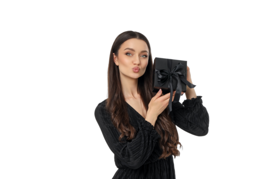 Woman joyfully holds a gift on Black Friday, isolated, PNG - Powered by Adobe