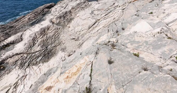 Rocky White Cliffs Overlooking Adriatic Sea From Shore Of Dugi Otok In Zadar, Croatia. drone tilt-up shot