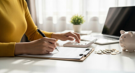 Person using calculator tax finance budget financial accounting payment debt planning document with coins and piggy bank