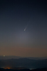 comet c/2025 a6 (lemmon) glowing in the pre-dawn sky above mountain ridges on october 29, 2025, when the comet reached perihelion, its closest approach to the sun.