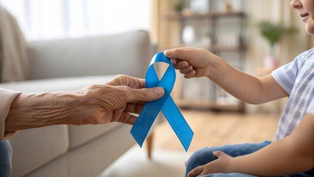 Elderly hand passing blue diabetes awareness ribbon to child