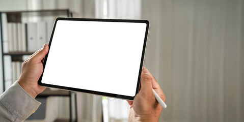 businessman holds a mockup. iPad digital tablet with blank screen Mockup replaces your design...