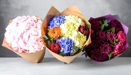Three vibrant flower bouquets in paper wrapping