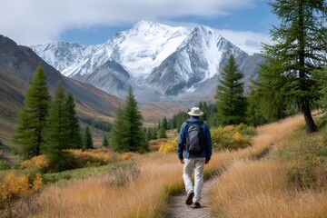 Fototapeta premium Man hiking mountain path enjoying nature view