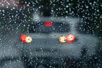 Raindrops on the car window. Rain during the car trip.