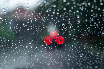 Car window glass with raindrops after rain