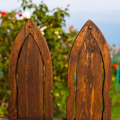 Wooden fence and green foliage
