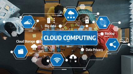 A top-down view of a diverse team collaborating on cloud computing solutions. The image highlights...