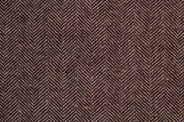 Cloth coats melange. The texture of the coat fabric close-up.