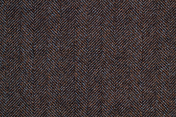 Cloth coats melange. The texture of the coat fabric close-up.