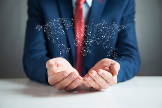 Businessman holding digital tactile world in screen