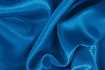 Blue fabric cloth texture for background and design art work, beautiful crumpled pattern of silk or linen.