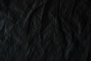 Creased cloth Dark matte black texture background 