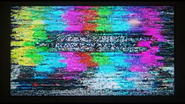 Abstract Colorful Static on Television Screen Illustrating Technical Difficulties