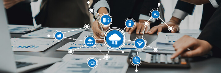 A dynamic office scene showcasing a team collaborating on cloud computing technology, working together on data analysis and innovative solutions in a modern workspace. Amity