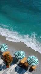 Top View Of A Serene Rocky Beach With Teal Ocean Waves And White Striped Umbrellas On A Sunny Day