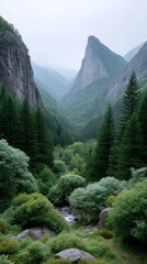 Misty Mountain Valley With Vertical Stone Peaks Covered In Lush Green Forest And Blooming Wildflowers Under Overcast Sky