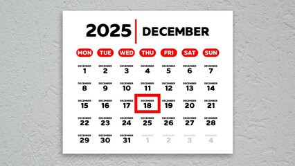 The date December 18th marked with a red cursor on the wall calendar 2025