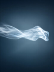 Abstract ethereal smoke wisps flowing on a dark blue background