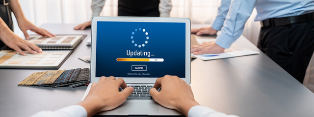 Group of interior architect designer team at table choosing various mood board samples with...