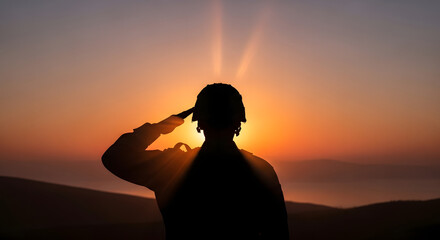 Silhouette of a soldier saluting against a vibrant sunset, honoring service and sacrifice.