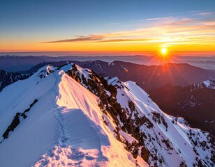 Sunrise over snow-capped mountain ridge