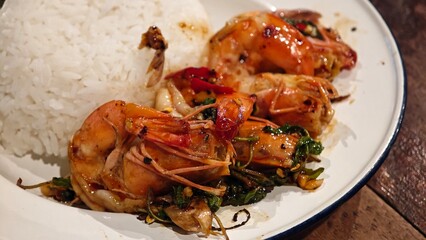 Stir fry prawn with holy basil.