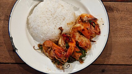 Stir fry prawn with holy basil.