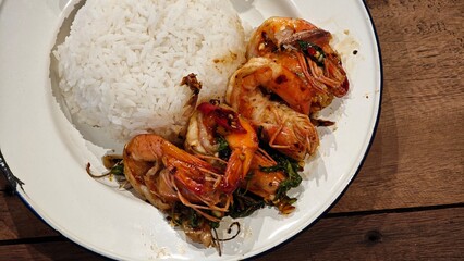 Stir fry prawn with holy basil.