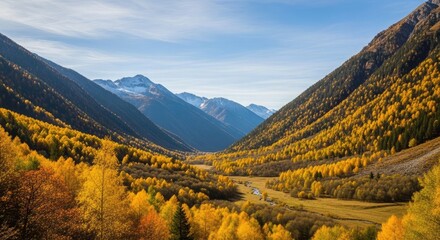 Stunning autumn landscape with golden trees blanketing majestic mountains under a clear blue sky, perfect for travel blogs, nature promotions, and serene background visuals