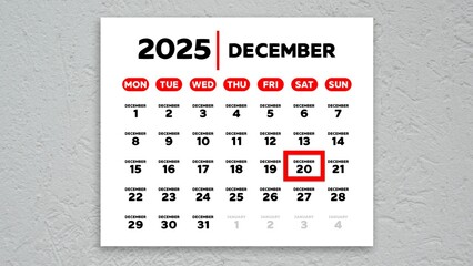 The date December 20th marked with a red cursor on the wall calendar 2025