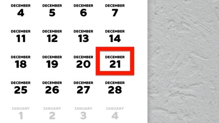 Close-up of the date December 21st marked with a red cursor on the wall calendar 2025