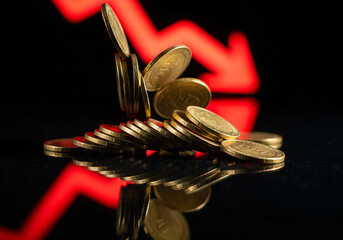 financial crisis concept with stacks of coins and a declining red graph in the background symbolizing an economic downturn