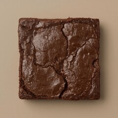 Chocolate brownie square on beige background  