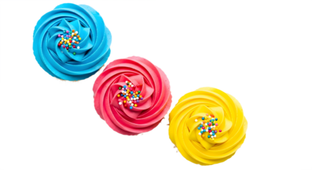 Aerial view of three cupcakes with colorful frosting and sprinkles on a black background studio shot