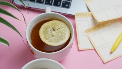 close up a cup of tea and a book