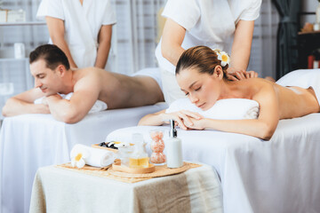 Caucasian couple customer enjoying relaxing anti-stress spa massage and pampering with beauty skin...
