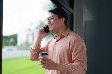 Young Professional on Phone Call in Bright Workspace
