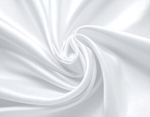 Obraz premium A close-up view of a spiraling, white satin fabric. The folds catch the light, creating shadows
